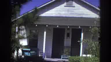 Atlanta Georgia USA (1975): People Walk Past A Car Toward The Porch Of A Small