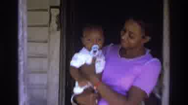 Atlanta Georgia USA (1975): Mom Holds Baby Outside On Porch With Two Other Adults