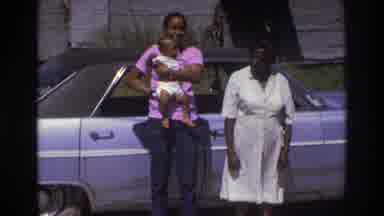Atlanta Georgia USA (1975): Two Women Hold Baby Standing Next To Car Man Wearing