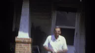 Atlanta Georgia USA (1975): A Man Standing At His Porch Put A Towel On His Back