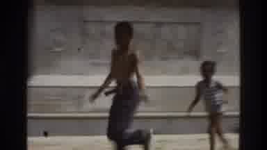Atlanta Georgia USA (1975): Two Boys Are Running Towards The Statue And Trying To