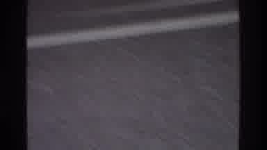 Atlanta Georgia USA (1975): A Man Is Running In The Ground And The Kid Is Playing