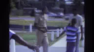 Atlanta Georgia USA (1975): Two Kids Are Playing In A Park With Three Members