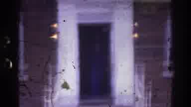 Atlanta Georgia USA (1975): Woman Walks Steps Apartment White Doorway Blue Sweater