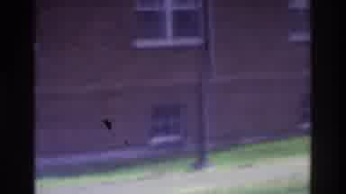 Atlanta Georgia USA (1975): Unidentifiable Person Walking Outside Across A
