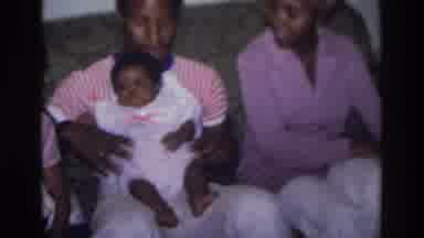 Atlanta Georgia USA (1975): Man Bouncing A Baby On His Knee While A Woman And