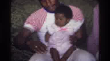 Atlanta Georgia USA (1975): Man Is Interacting With A Baby Girl On His Lap