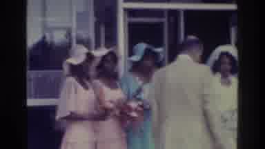 Bronx New York USA (1975): Man Arranges The Luxuriously Dressed Ladies Together