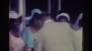 Bronx New York USA (1975): Man With Suit Greeting Nicely Dressed Women In A