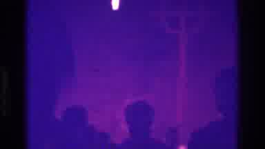 Bronx New York USA (1975): Woman In Floppy Bonnet Walks In Dimly Lit Purple Room,