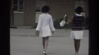 Bronx New York USA (1975): Two Women Dressed Walking Slow Clear Day Talking With