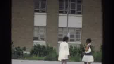 Bronx New York USA (1975): Women Wearing White Dresses Walking Toward Building,