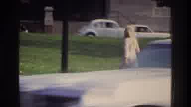 Washington DC USA (1975): Woman Walking Footpath As Cars Seen Driving Past Via