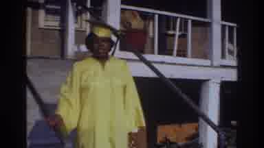 Washington DC USA (1975): Young Woman In A Yellow Graduation Cap And Gown Walks