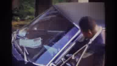 Washington DC USA (1975): Man And Woman Getting In Their Car To Take A Trip