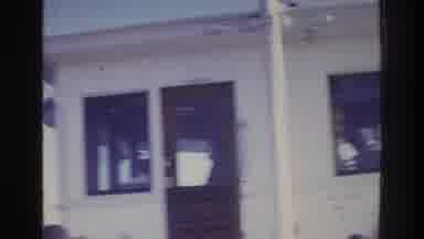 Washington DC USA (1975): Crowd Stands Together Outside White Building While