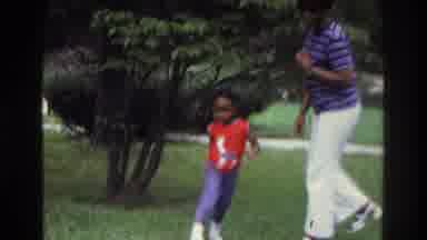 Washington DC USA (1975): Black Woman And Black Child Playing On A Lawn Black Dog