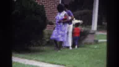 Washington DC USA (1975): Child Running Between Family Members Around The Outside
