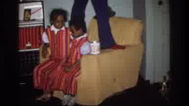 Washington DC USA (1975): Two Girls Sitting On The Sofa And One Lady Standing Near