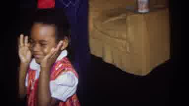 Washington DC USA (1975): Young Girl Smiles And Makes Faces At Camera While Puppy