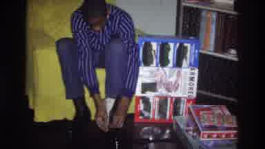 Washington DC USA (1975): African American Teenager Trying On The Shoes That He