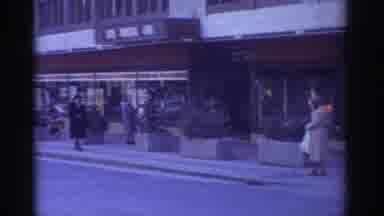 Bern Switzerland (1976): Busy Streets In The City In Front Of A Hotel, Cinema, And