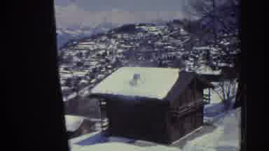 Bern Swisterland (1976): A Cabin Sits In A Snow Covered Area With Snow On Its Roof