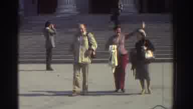 Greece (1976): Woman Waves Happily On Leaving A Historic Building Accompanied By