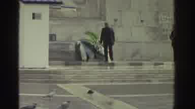 GREECE-1976: Man Places Wreath at Memorial Then Bus Ride