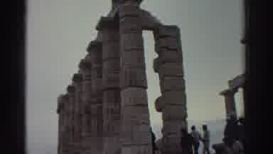 Greece (1976): Crowd Gathers To Spectate Roman Ruins On A Windy Day While Lone