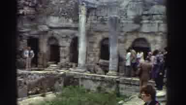 GREECE-1976: Tourists Explore Ancient Ruins with Stone Columns
