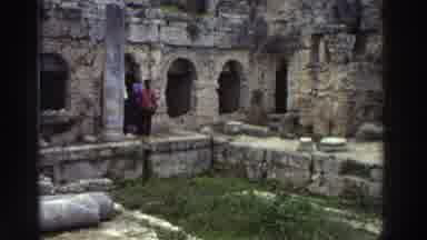 GREECE-1976: Tourists Stroll Around Ancient Ruins On A Chilly Day