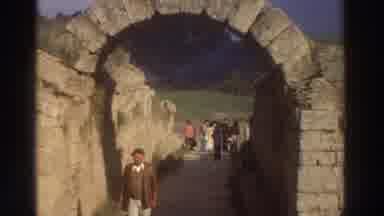 Greece (1976): Strangers Are Enjoying A Nice Day Outside Under The Arch
