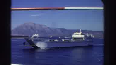Greece (1976): Ship Transporting People And Autos With Old Fort In Background