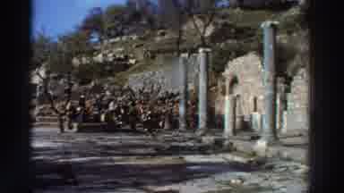 Greece (1976): Tourists Look At Ancient Roman Pillars In An Old Archeological Site