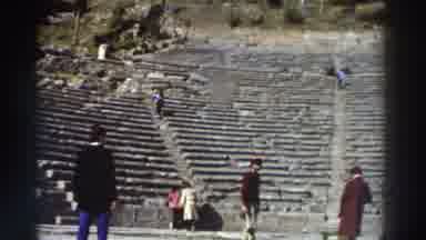 GREECE-1976: Tourists Wander Around An Old Stone Amphitheater, Some Walking Down