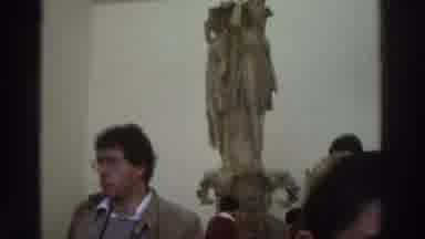 GREECE-1976: People Viewing Ancient Statues and Hillside Village