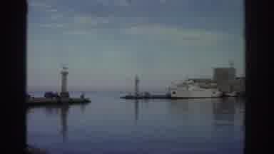 Greece (1976): Sliding Camera View Of A Historical Building And Boats Docked On A
