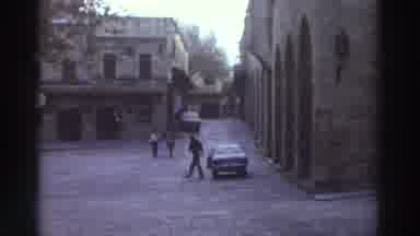 GREECE-1976: A Boy Playing At The Road, A Man Get Out From His Car
