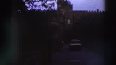 GREECE-1976: Car Driving Through Stone Gateway With Crenellated Walls