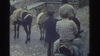 Greece (1976): Two Guys Get Guided As They Ride On A Donkey And Another Guy Stands