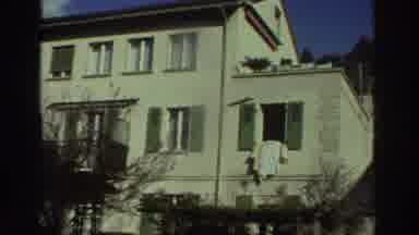Greece (1976): A Large House Or Apartment With A Man And A Woman Walking Onto The