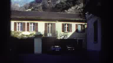 Greece (1976): Multistory Homes Are Captured As A Car Drives By