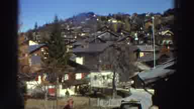 GREECE-1976: Slow Moving Camera Shows Many Homes Side By Side As Woman Stands