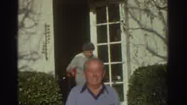 Greece (1976): Two Men And Two Women Are Walking Out Form The House
