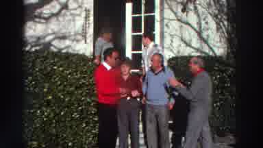 GREECE-1976: Family Members Hugging Outside House In 8mm Home Movie