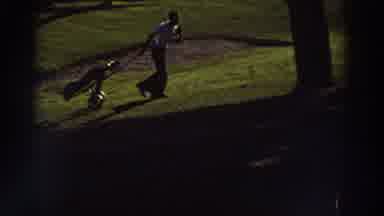 Greece (1976): Two Guys Pulling A Gold Bag And Golfing