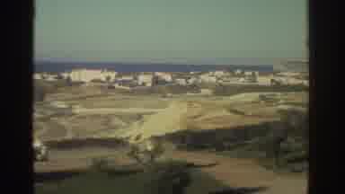 Greece (1976): Large White Building Overlooking A European Seaside Village