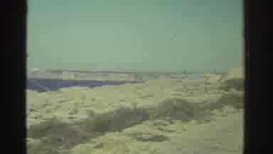 GREECE-1976: Man Fishing By The Sea As Cannon Points Out To Water