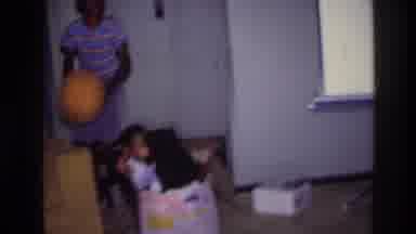 Harlem New York USA (1976): 3 Kids Play In Large Cardboard Box While Older Child